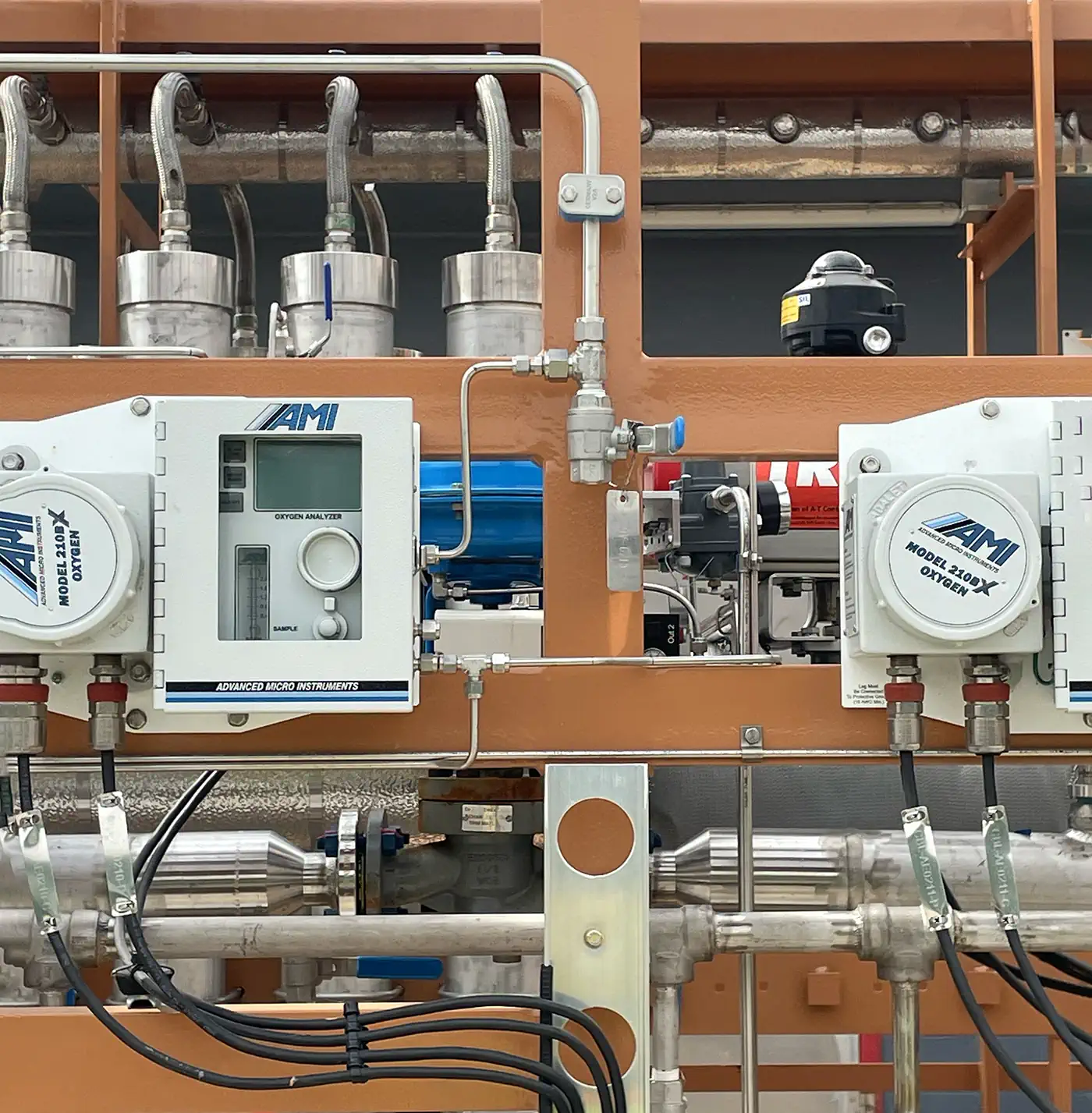 AMI Model 210BX Oxygen Analyzers on an industrial frame.
