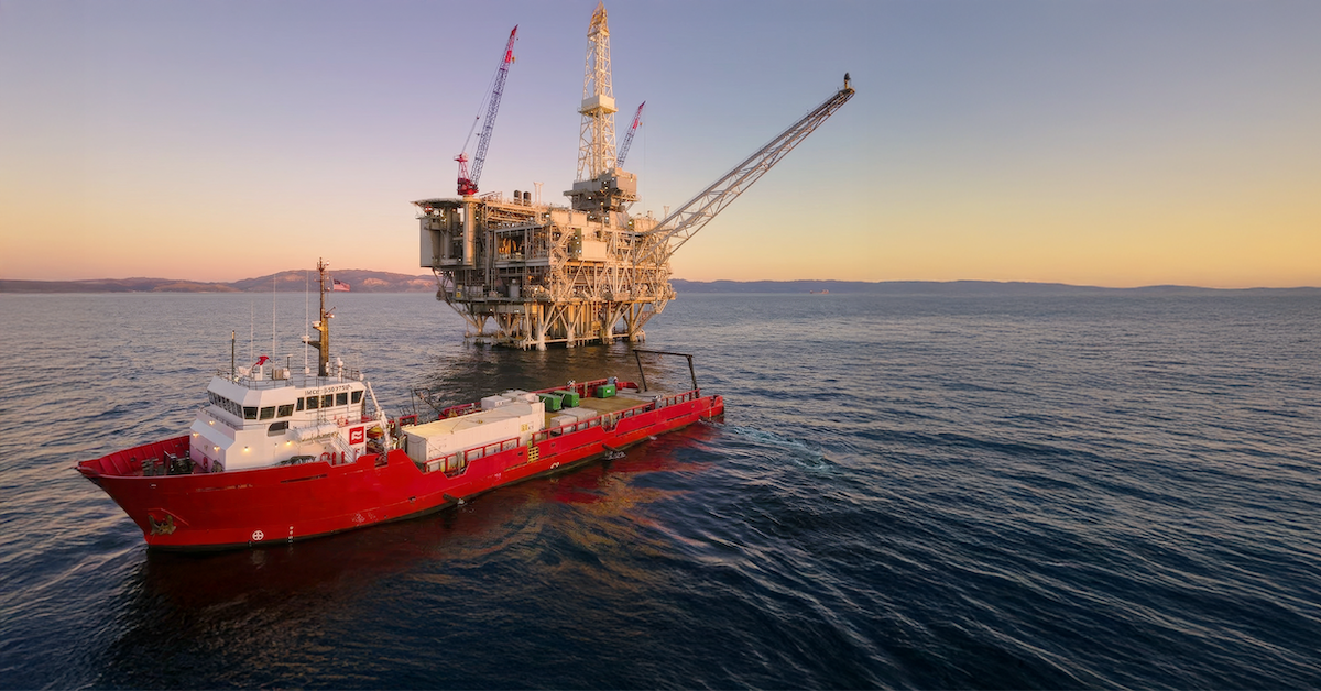Offshore supply vessel alongside an offshore platform, illustrating the operating environment considered during design head calculations for offshore modules.