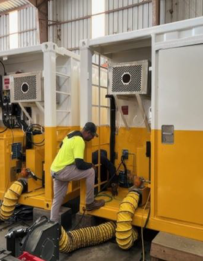 Technician performing refurbishment work on an offshore module