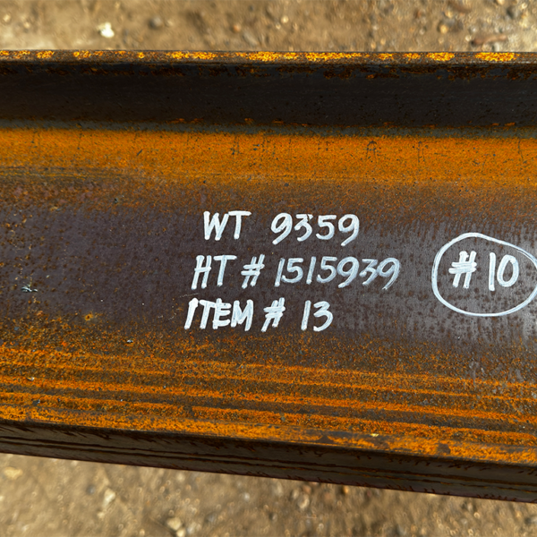 Close-up of structural steel marked with item ID for offshore material traceability.